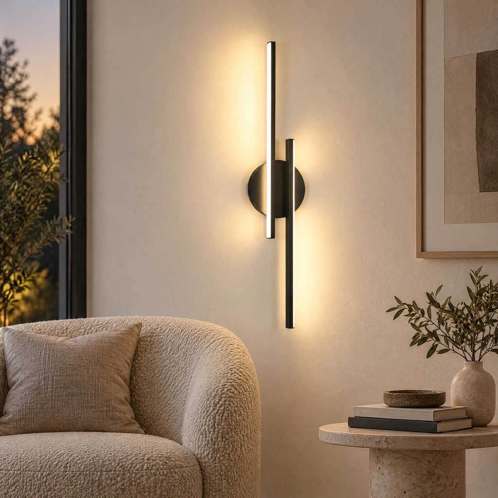 Wall Sconce Richard, a black linear LED wall light beside an armchair