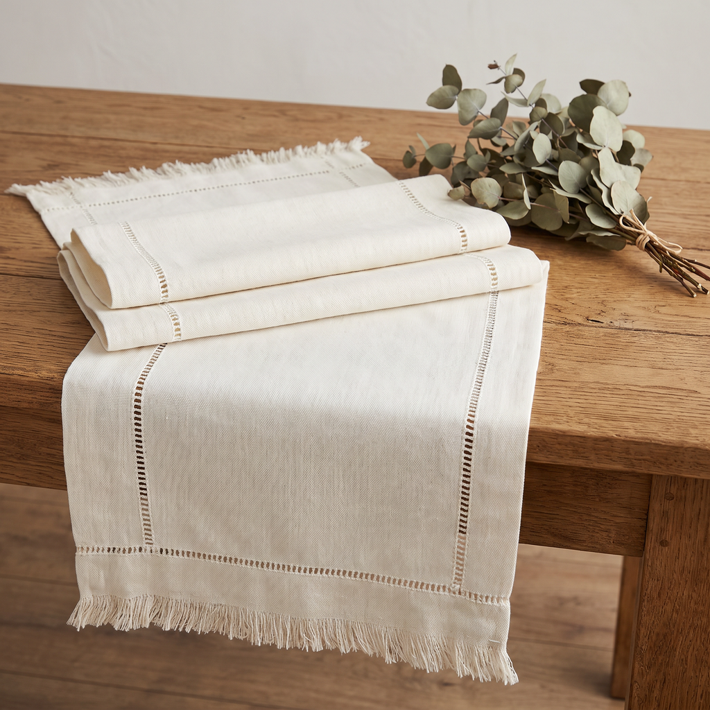 Lipa table runner folded on a wooden table showing natural linen weave